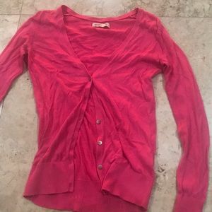 Pink cardigan. Tight on the arms